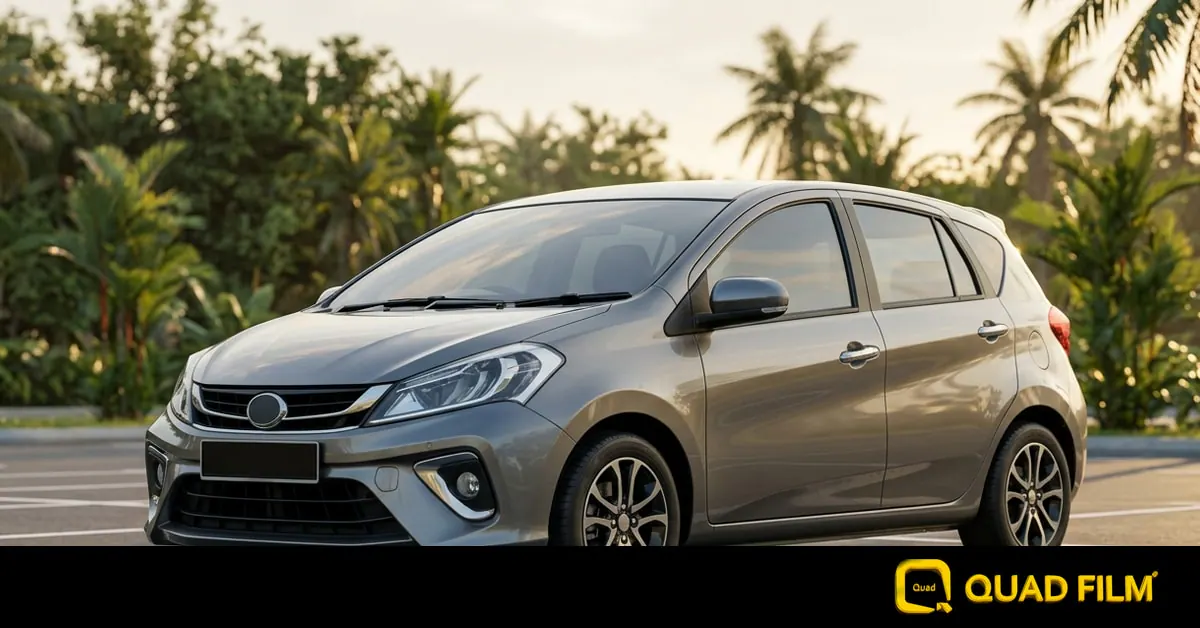 A freshly tinted family hatchback with all windows wound up, showing the light haze that appears while tint is still curing.
