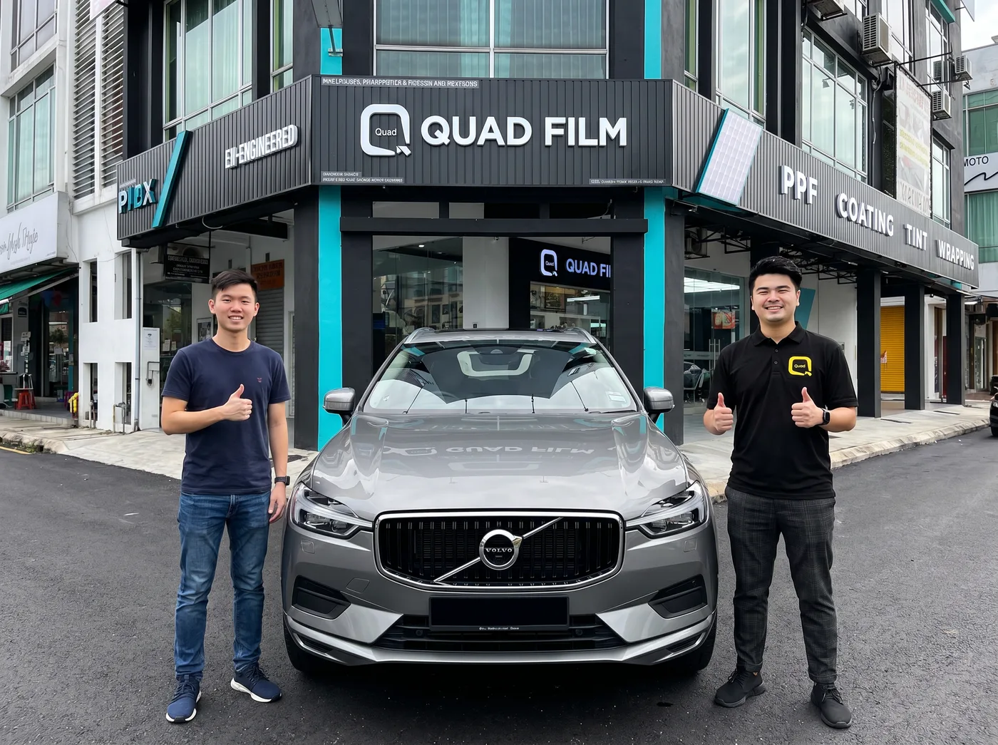 Quad Film 团队与 Volvo XC60 车主在 PPF 安装后合照