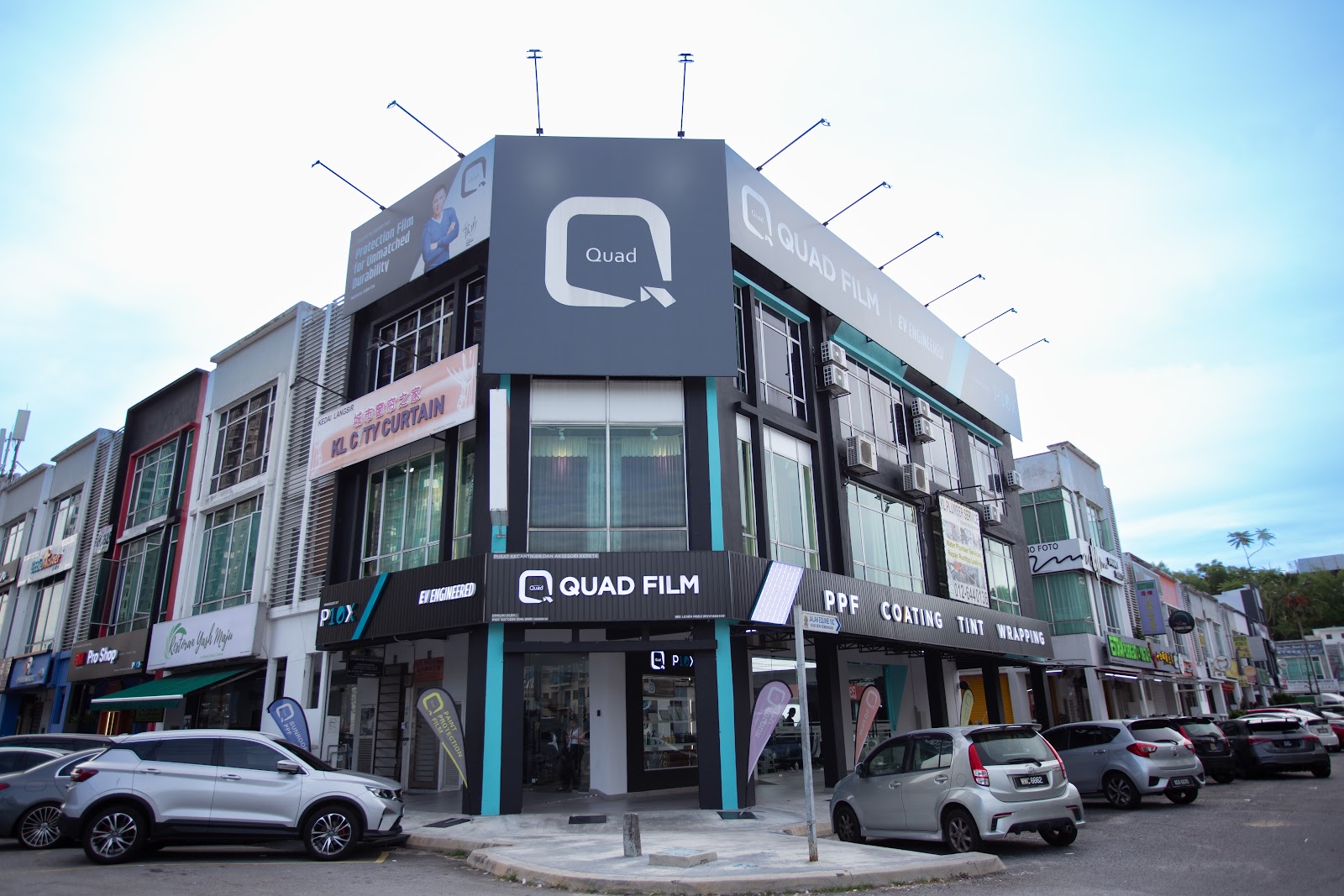 quad film outlet storefront